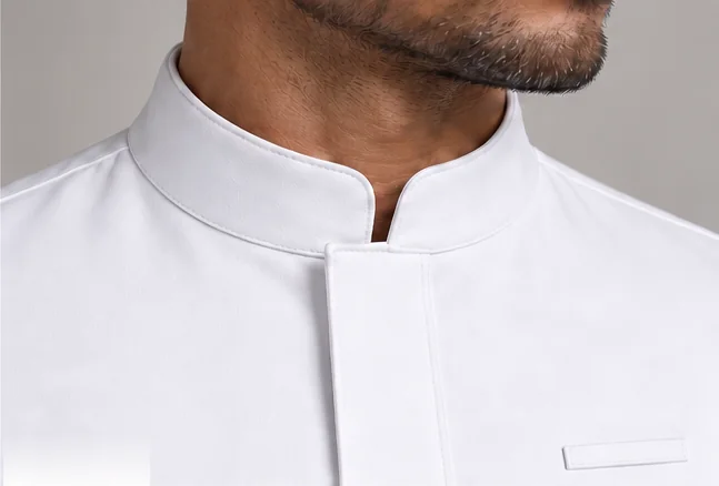 The low mandarin collar and concealed placket of the Riyadh coat.